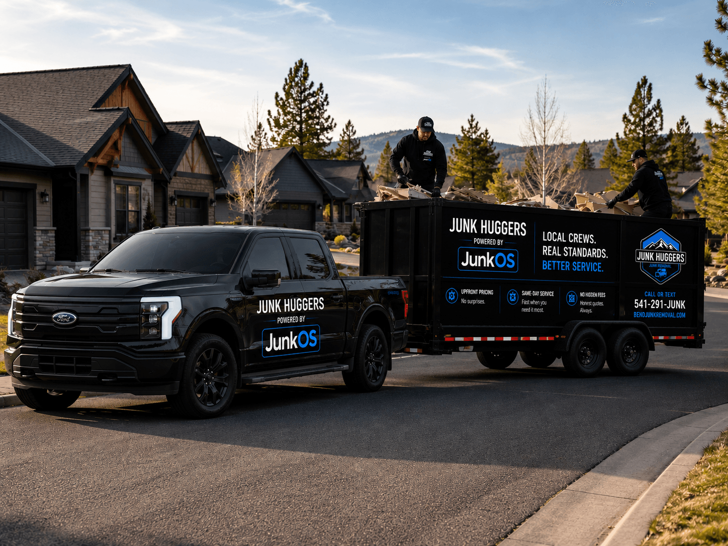 Junk Huggers™ branded truck and trailer staged in a Bend neighborhood