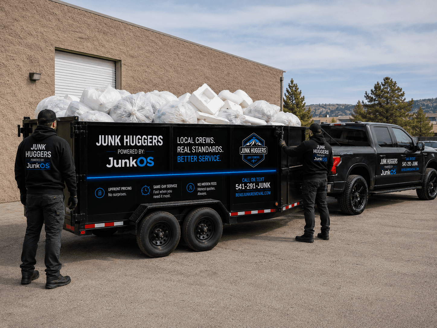 Junk Huggers ultralight pickup with a small load of bags, boxes, and packaging